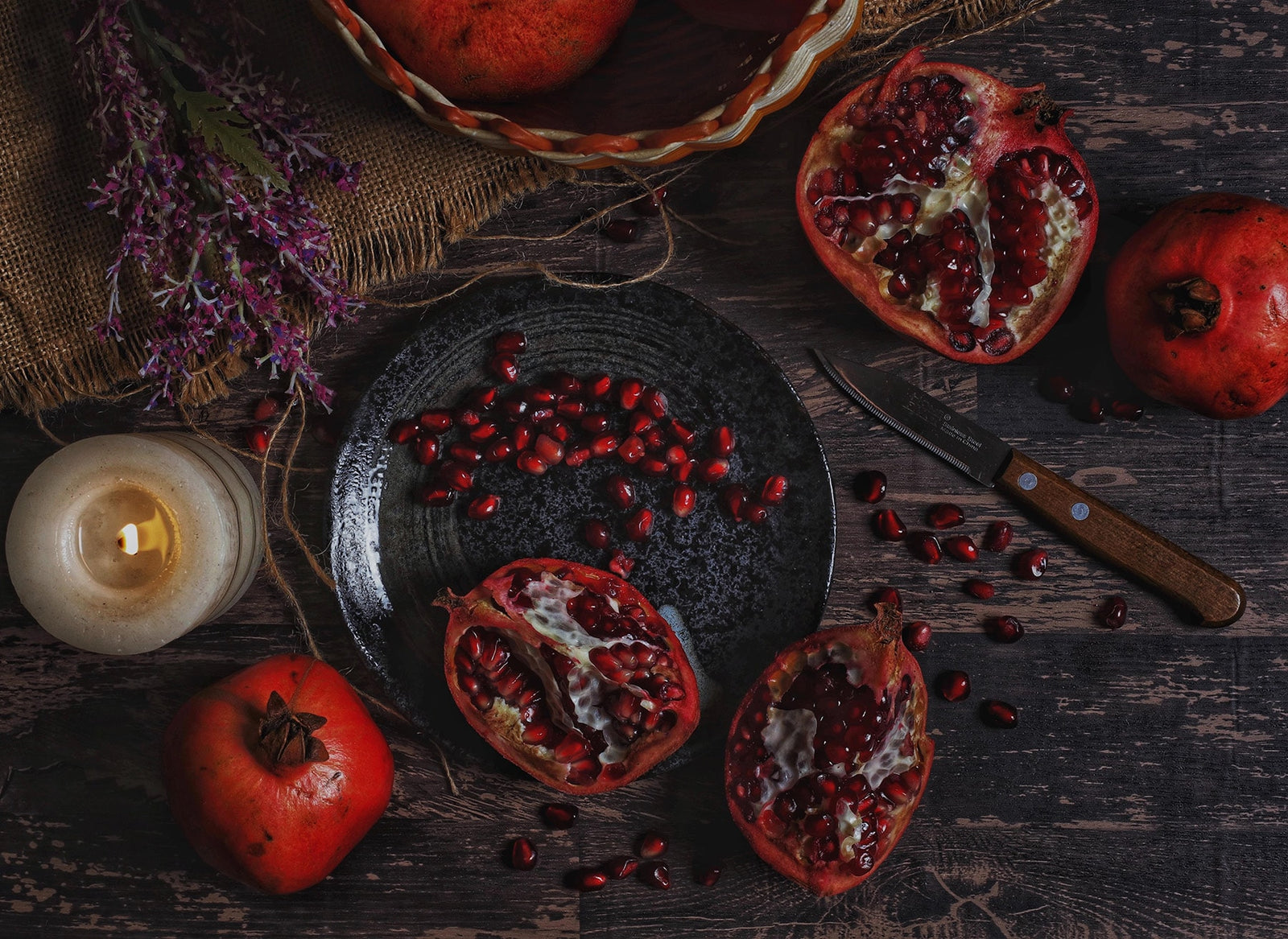 Spiced C Elixir with Eucalyptus Blossom Honey Pomegranates on dark wood boards