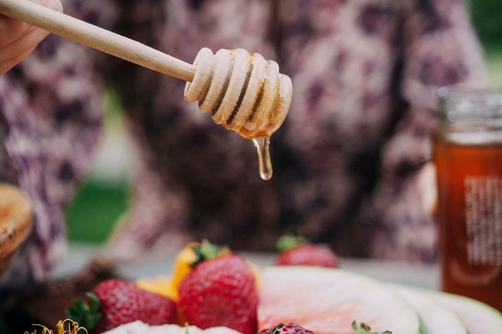 Honey dripping onto fruit